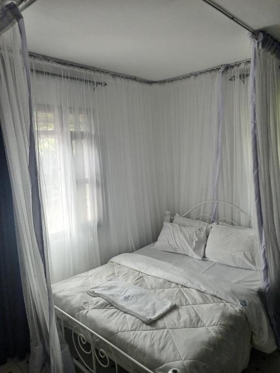 Postel nebo postele na pokoji v ubytování MELVIC INN