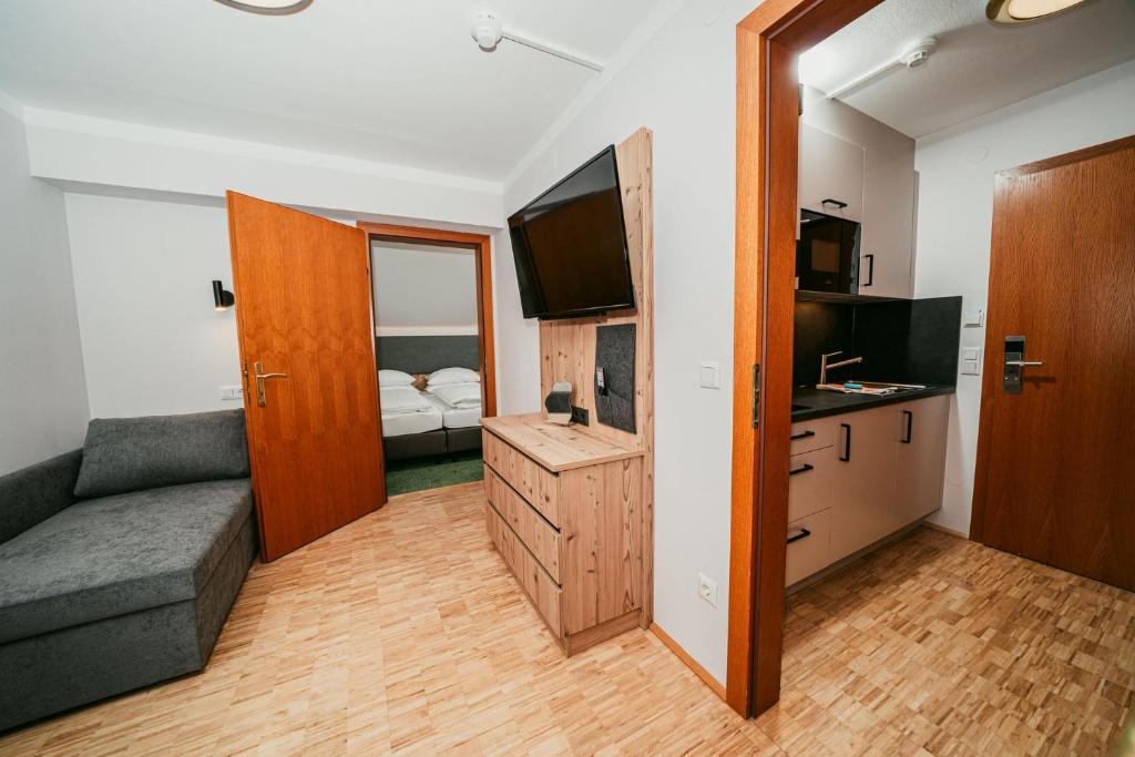 TV a/nebo společenská místnost v ubytování Apparthotel Samson