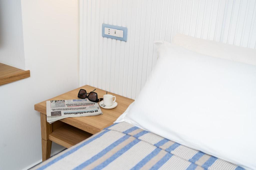 Postel nebo postele na pokoji v ubytování Grenilù Sea