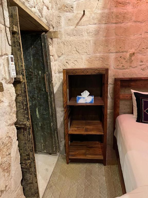 Postel nebo postele na pokoji v ubytování نزل كوفان التراثي Koofan Heritage Lodge