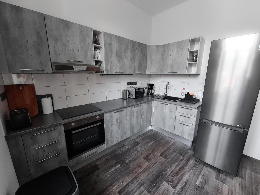 Kuchyň nebo kuchyňský kout v ubytování Apartmány u Maxíků