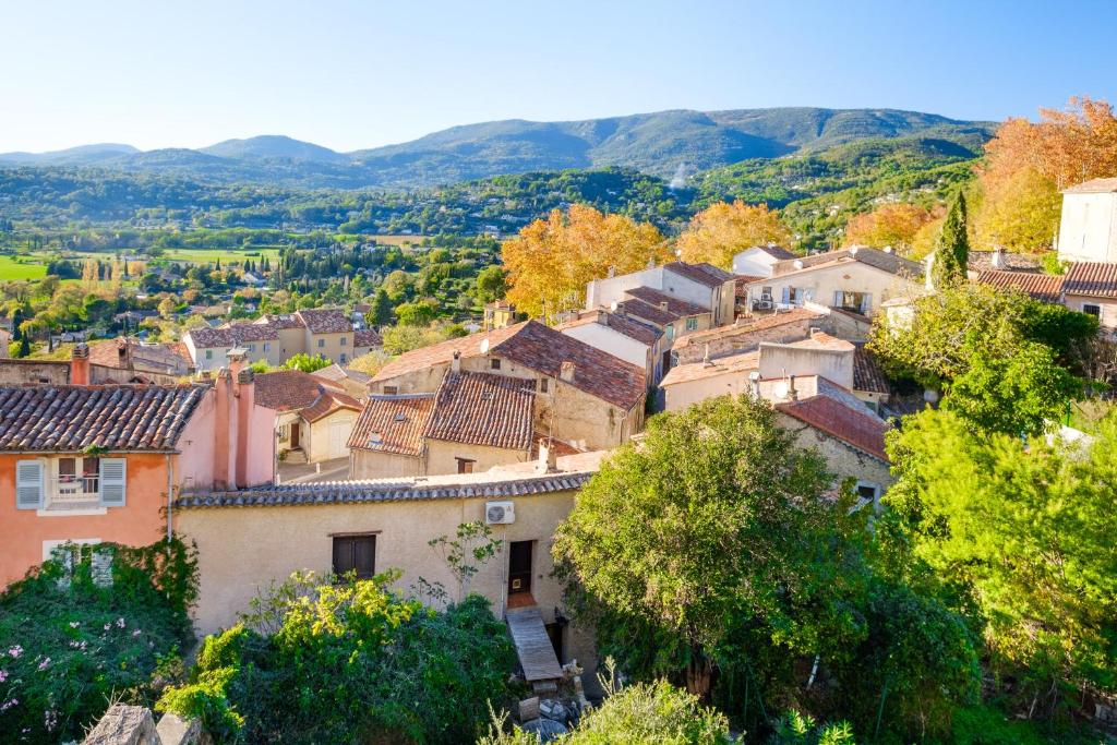 a town in the hills with trees and houses at Villa Provence Vue Panoramique - in Fayence