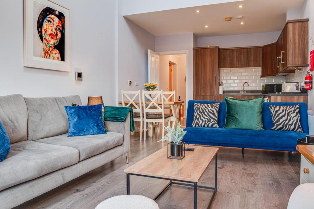 a living room with a couch and a table at City centre Top floor apartment in Belfast city centre in Belfast