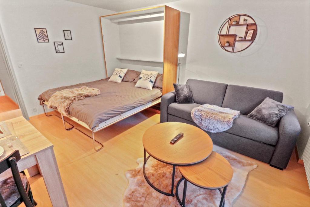 Postel nebo postele na pokoji v ubytování Chaleureux studio plein centre