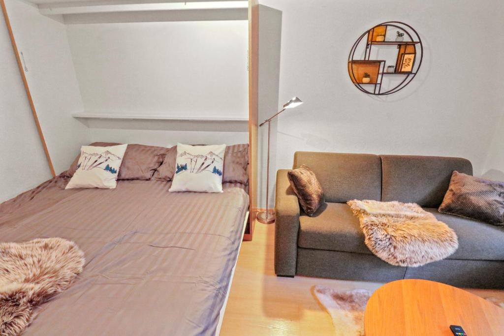 Postel nebo postele na pokoji v ubytování Chaleureux studio plein centre