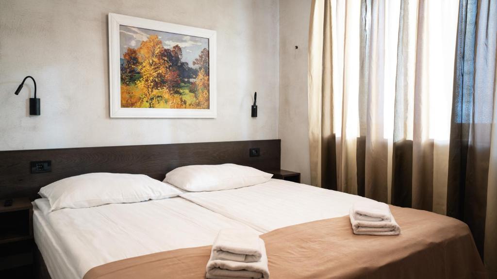 Postel nebo postele na pokoji v ubytování Aparthotel Vila San