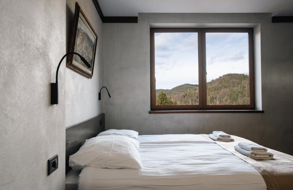 Postel nebo postele na pokoji v ubytování Aparthotel Vila San