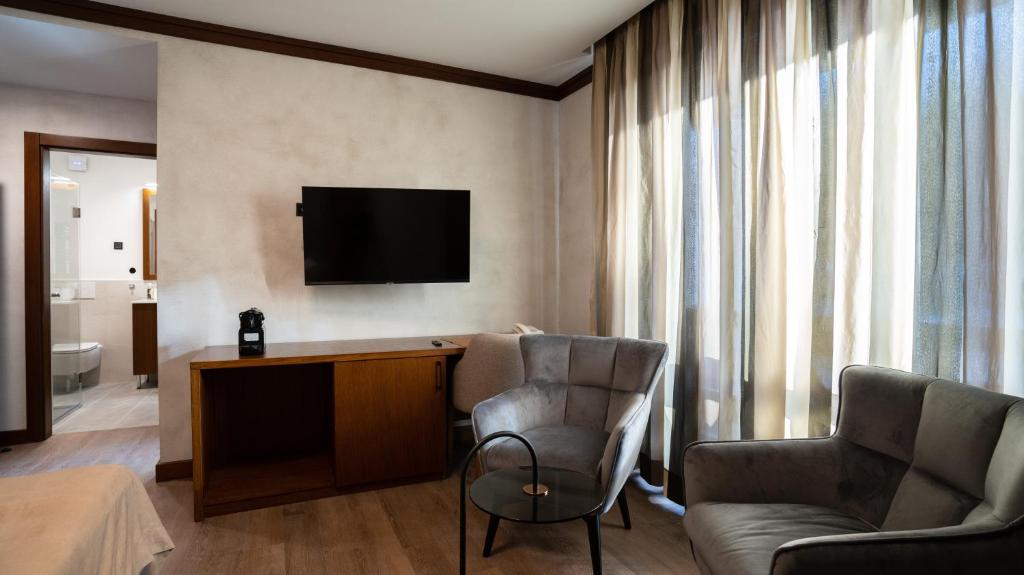 TV a/nebo společenská místnost v ubytování Aparthotel Vila San