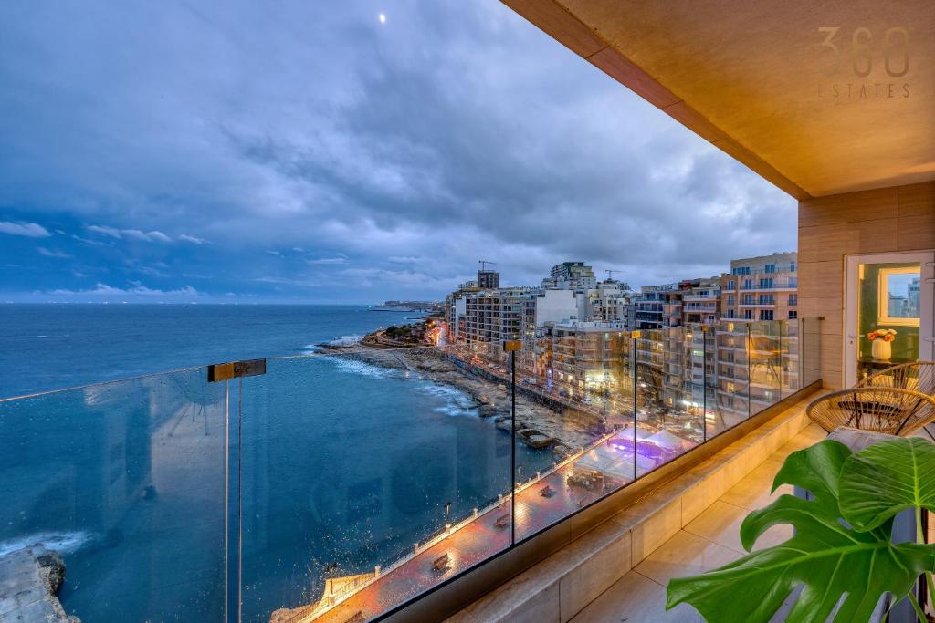 a balcony with a view of the ocean at Stunning, Seafront 3BR home in the heart of Sliema by 360 Estates in Sliema