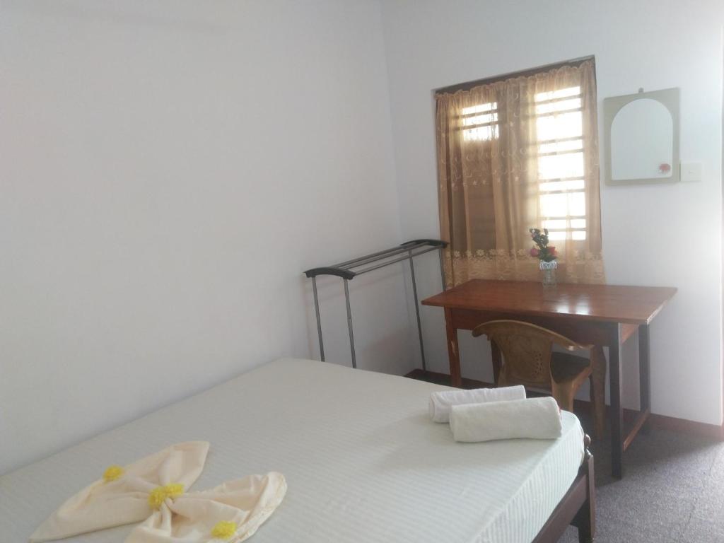 Voodi või voodid majutusasutuse Nethusaliguesthouse toas