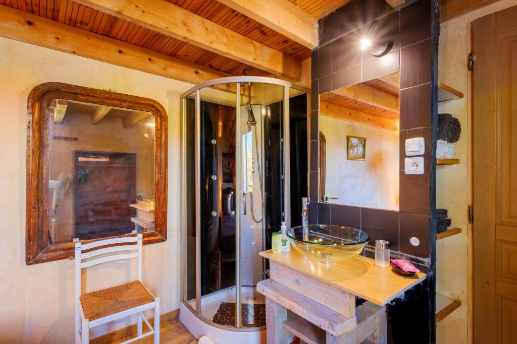 a bathroom with a glass sink and a shower at Villa Provence Vue Panoramique - in Fayence