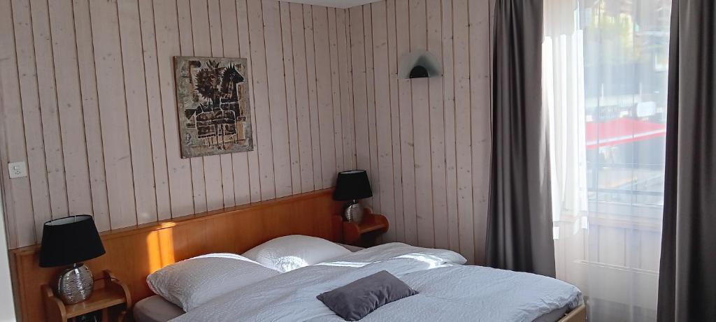Postel nebo postele na pokoji v ubytování Hotel Restaurant Le Giétroz