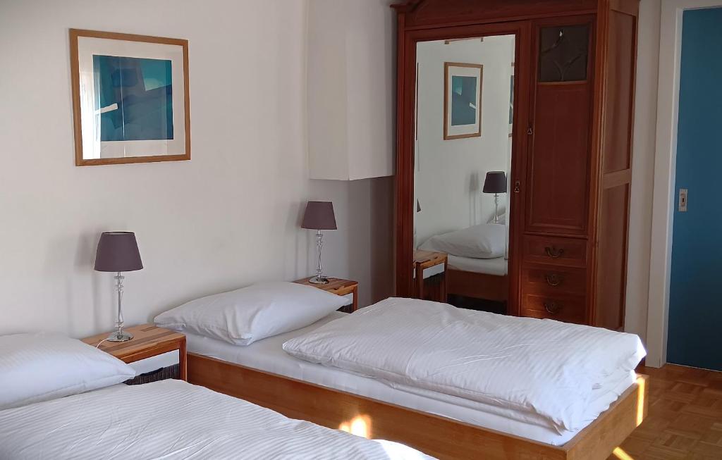 Postel nebo postele na pokoji v ubytování Hotel Restaurant Le Giétroz