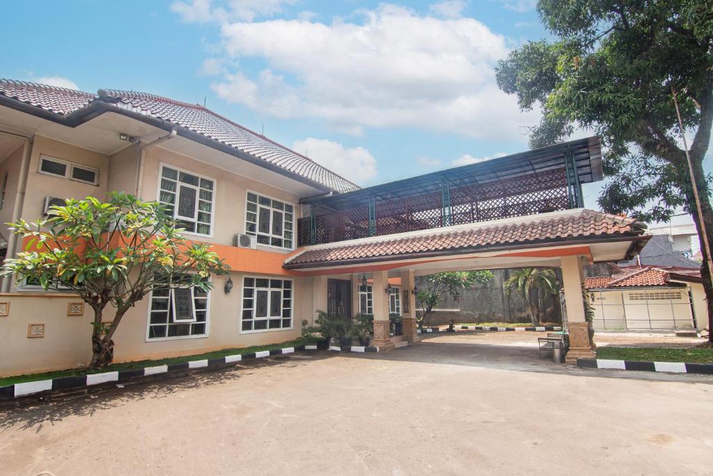 a building with a gate in front of it at Puri Sawo Manila Residence in Jakarta