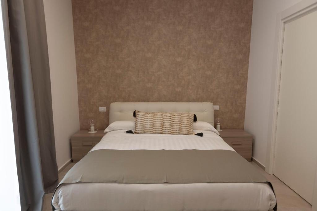 Postel nebo postele na pokoji v ubytování B&B Torre Canina suite & rooms