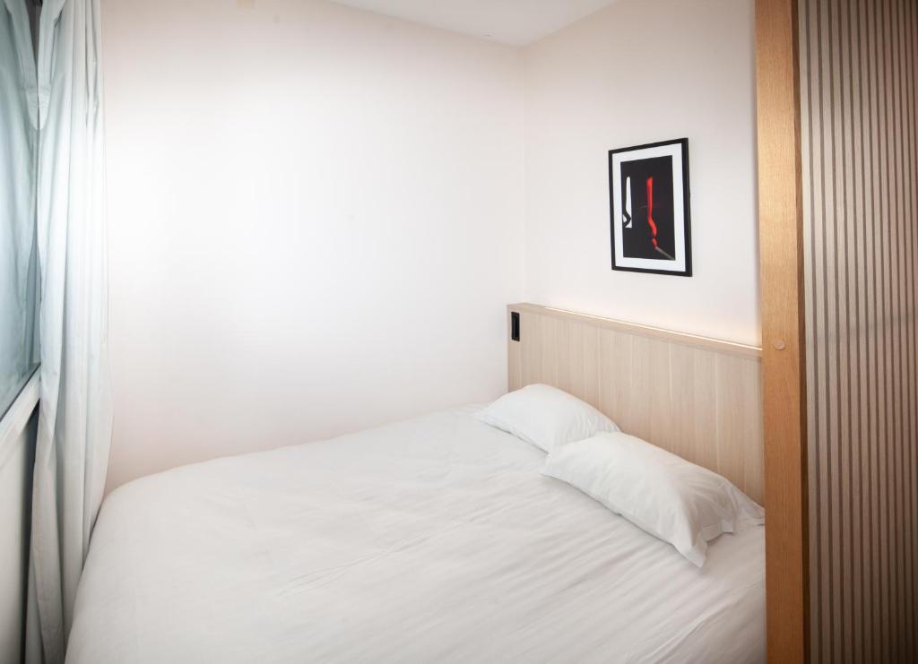 Łóżko lub łóżka w pokoju w obiekcie FINESTATE Coliving Mairie d'Issy