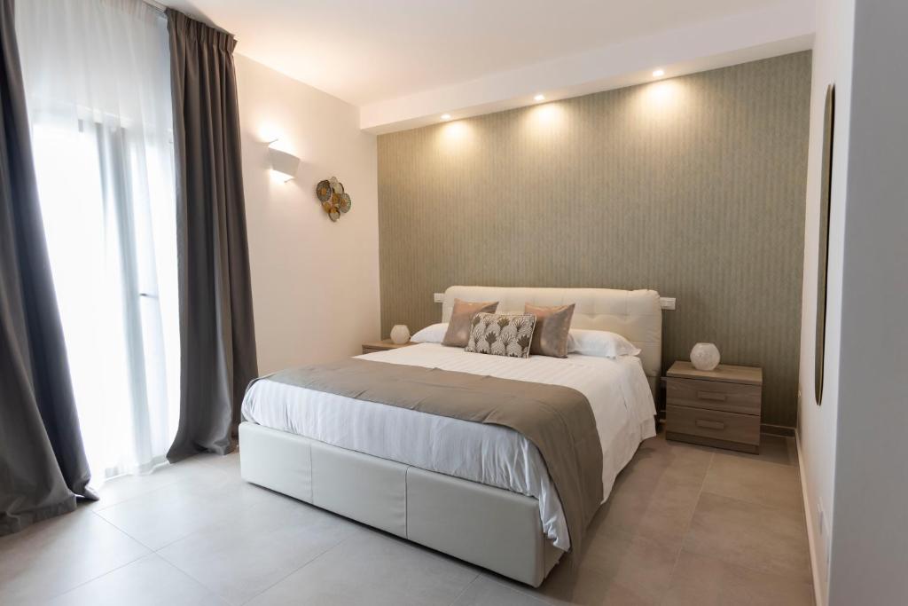 Postel nebo postele na pokoji v ubytování B&B Torre Canina suite & rooms