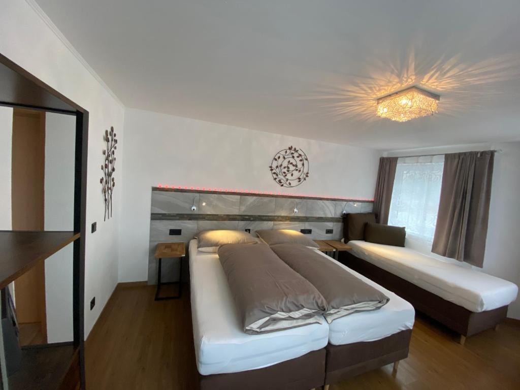 Postel nebo postele na pokoji v ubytování Haus Eder Steiner