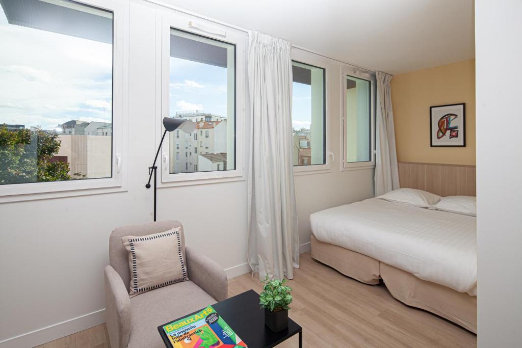 Łóżko lub łóżka w pokoju w obiekcie FINESTATE Coliving Mairie d'Issy