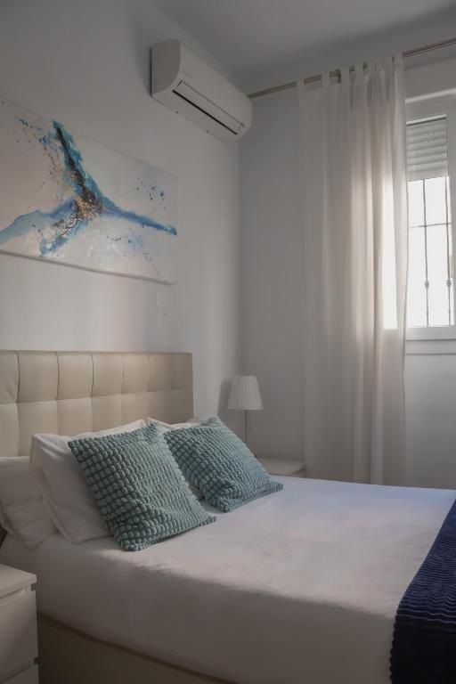 Posteľ alebo postele v izbe v ubytovaní Picasso Premium Apartment