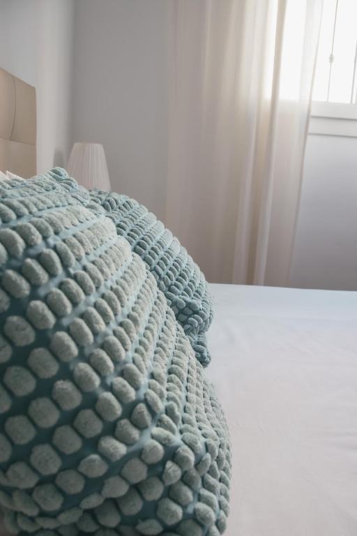 Posteľ alebo postele v izbe v ubytovaní Picasso Premium Apartment