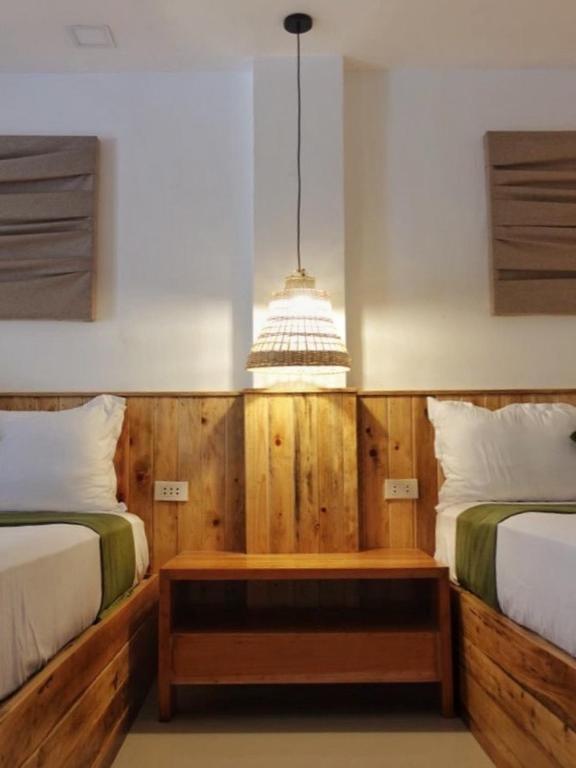 Postel nebo postele na pokoji v ubytování Senare Boracay Hotel