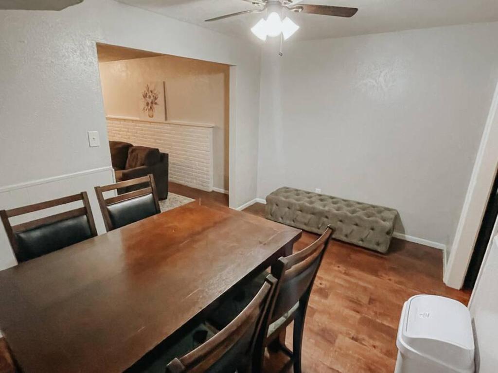 a dining room with a table and chairs and a couch at Workforce Ready 2 bedroom Home in Corpus Christi
