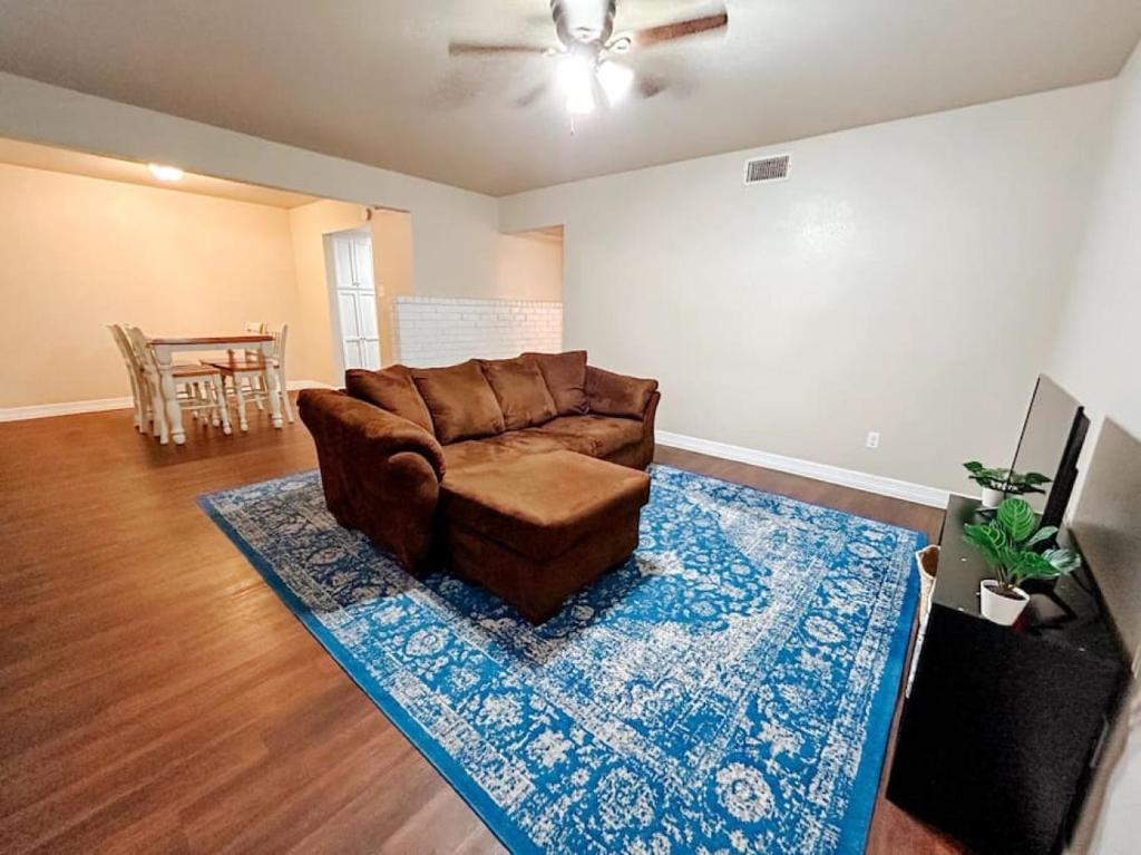 a living room with a couch and a rug at Workforce Ready 2 bedroom in Corpus Christi