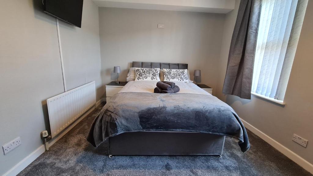 a bedroom with a large bed in a room at Connswater Town House Belfast in Belfast