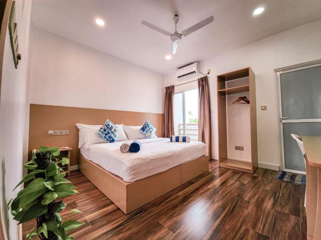Postel nebo postele na pokoji v ubytování Raalhu Fonu Maldives
