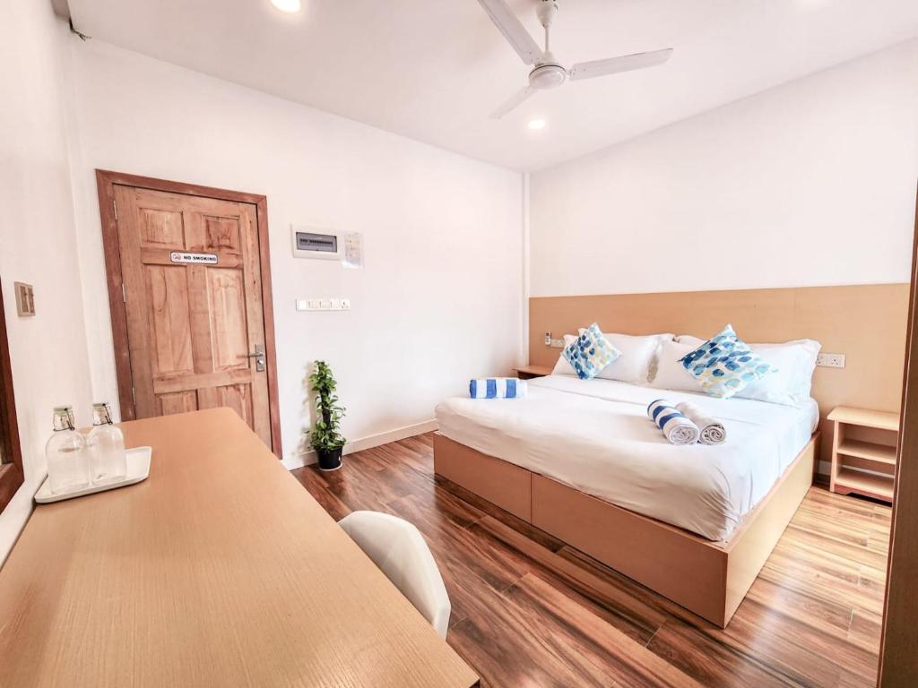 Postel nebo postele na pokoji v ubytování Raalhu Fonu Maldives
