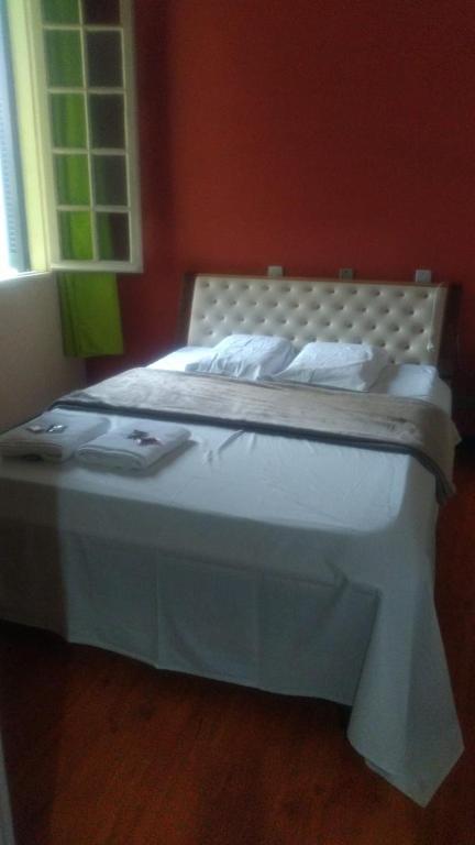 Postel nebo postele na pokoji v ubytování Hotel Real Centro