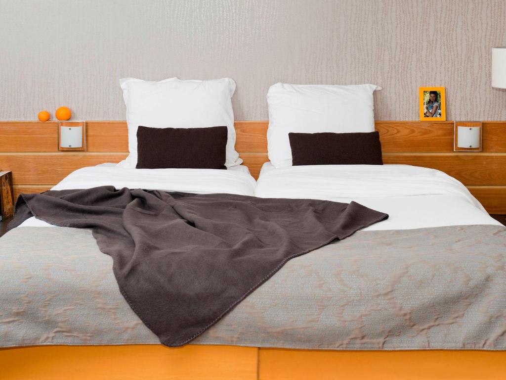 Postel nebo postele na pokoji v ubytování Aparthotel Adagio 4personnes paris 15eme,parking inclus ,proche Arena et parc expo