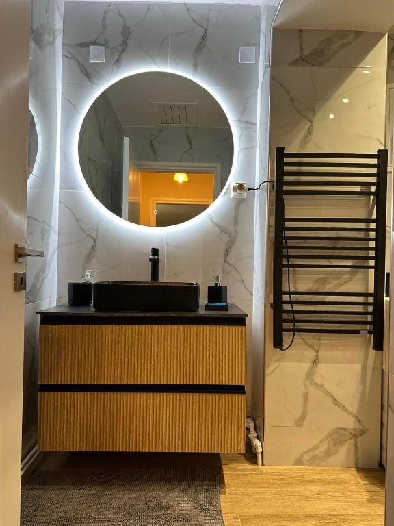 a bathroom with a sink and a mirror at Palaiomonastiro mountain resort 1 in Palaiomonástiron