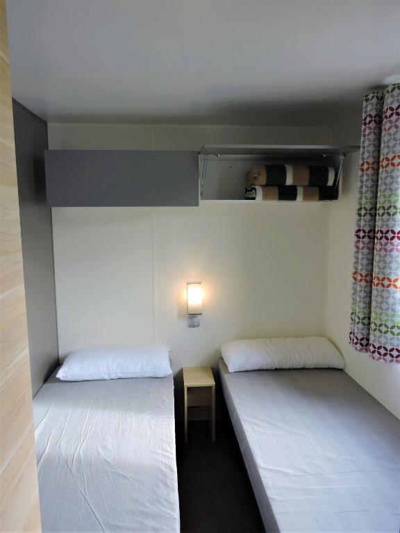 Postel nebo postele na pokoji v ubytování Camping Clarà
