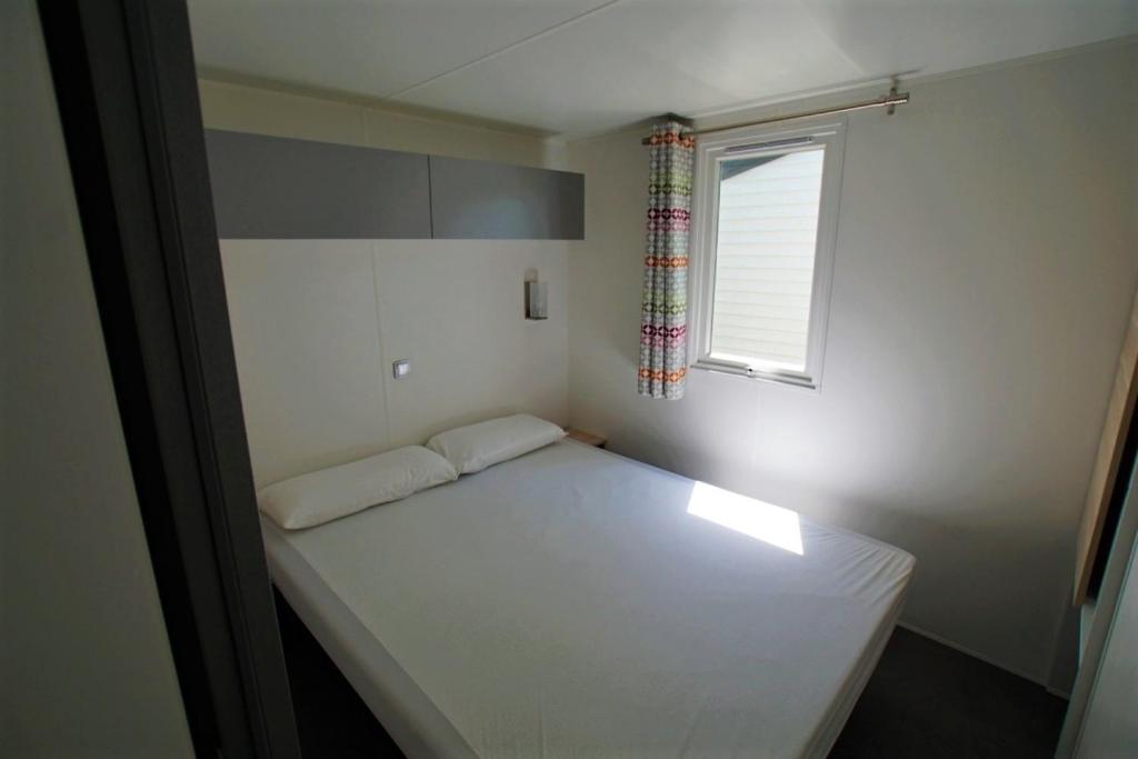 Postel nebo postele na pokoji v ubytování Camping Clarà