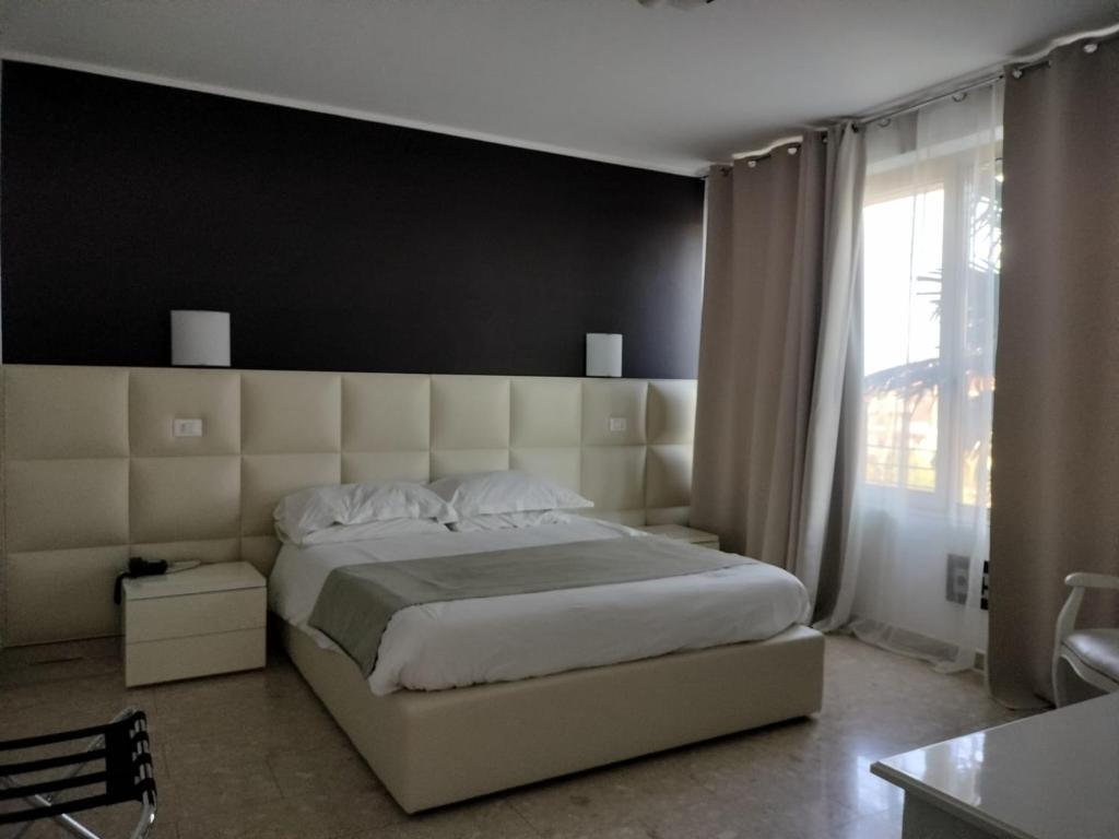 Postel nebo postele na pokoji v ubytování Hotel Noventa