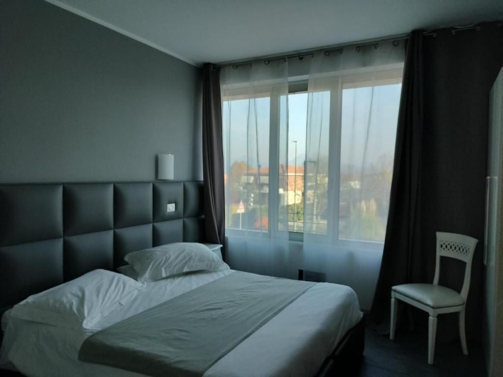 Postel nebo postele na pokoji v ubytování Hotel Noventa