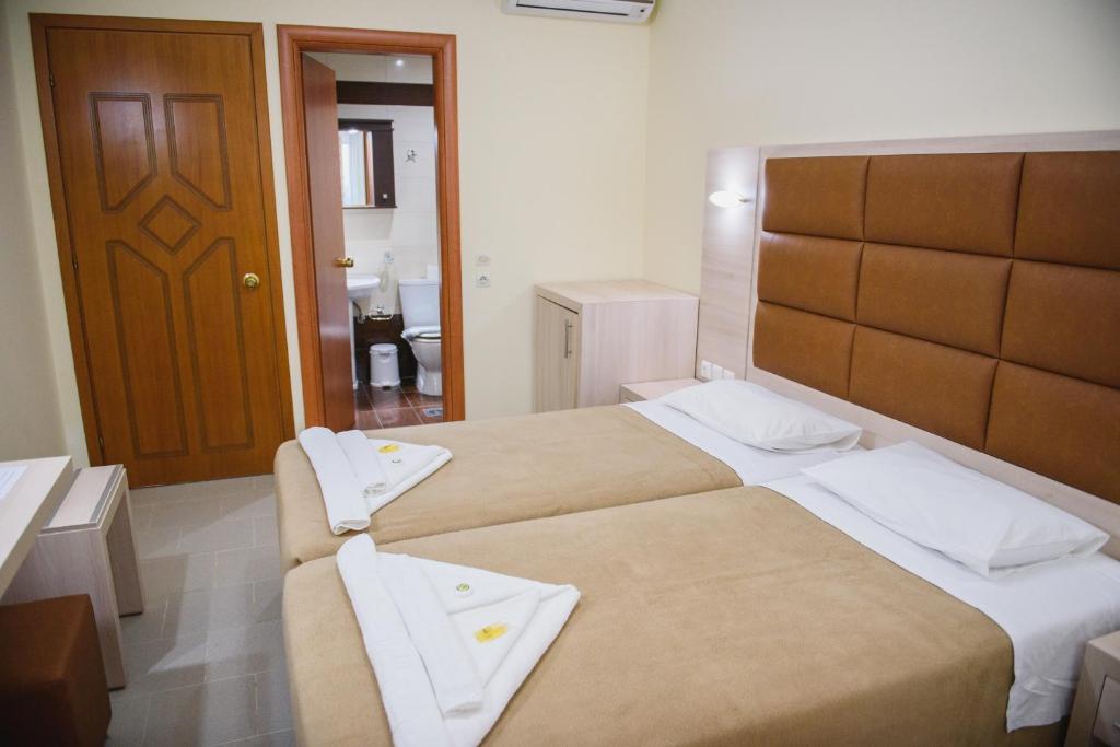 Posteľ alebo postele v izbe v ubytovaní Santa Rosa Hotel & Beach