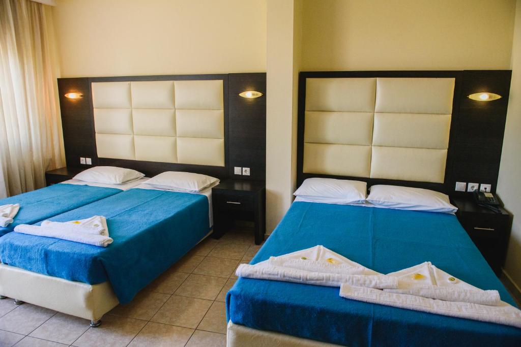 Posteľ alebo postele v izbe v ubytovaní Santa Rosa Hotel & Beach