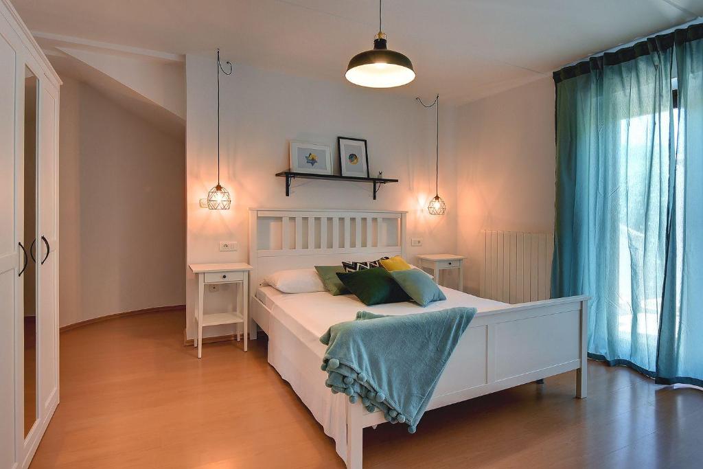Postel nebo postele na pokoji v ubytování Villa Mutila