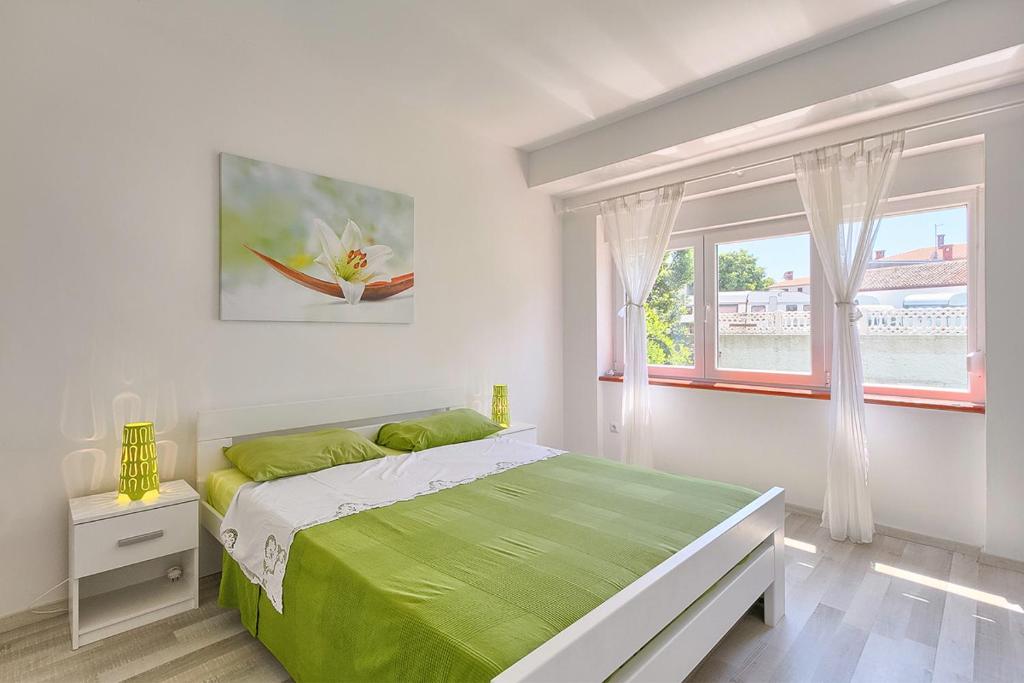 Postel nebo postele na pokoji v ubytování Im Jahr 2014 renoviertes Ferienhaus 400 Meter zum Strand