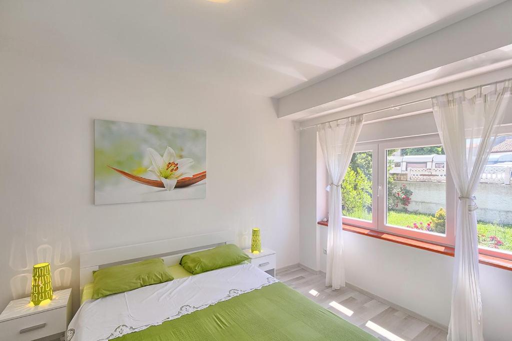 Postel nebo postele na pokoji v ubytování Im Jahr 2014 renoviertes Ferienhaus 400 Meter zum Strand