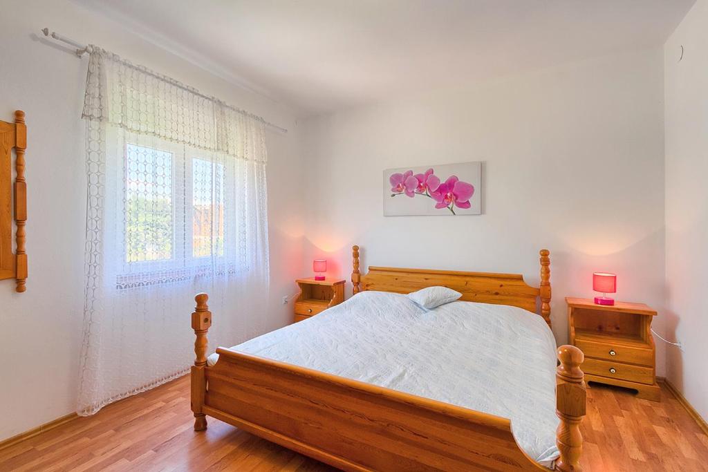 Postel nebo postele na pokoji v ubytování Im Jahr 2014 renoviertes Ferienhaus 400 Meter zum Strand