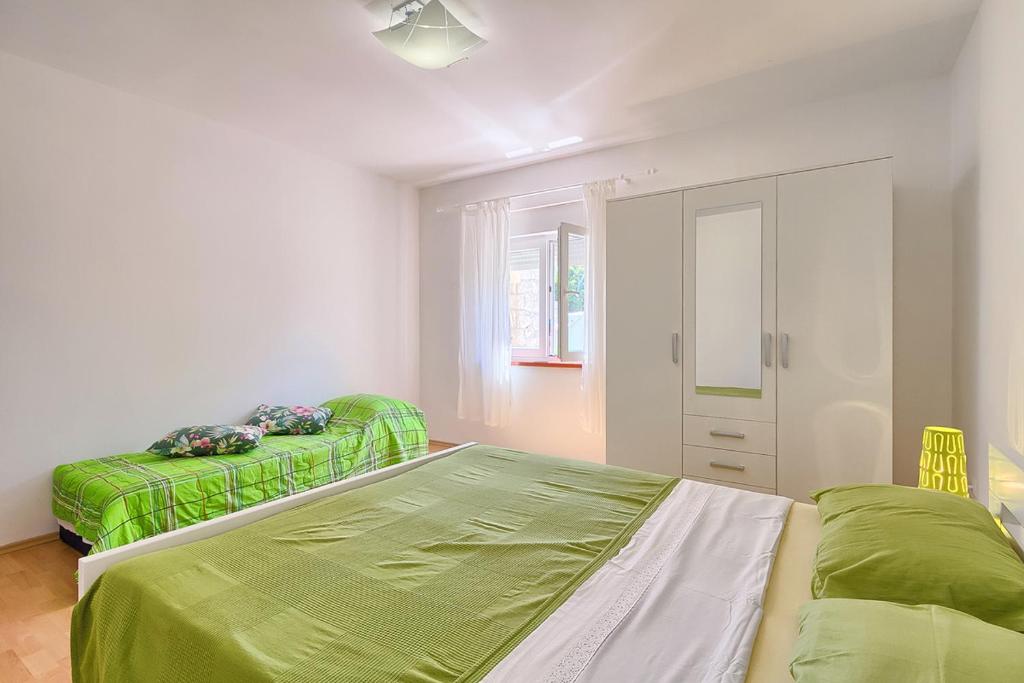 Postel nebo postele na pokoji v ubytování Im Jahr 2014 renoviertes Ferienhaus 400 Meter zum Strand