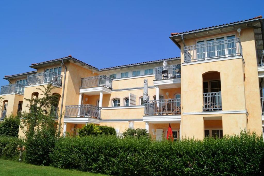 a large building with balconies on the side of it at Casa Nova, Wohnung 16 in Kühlungsborn