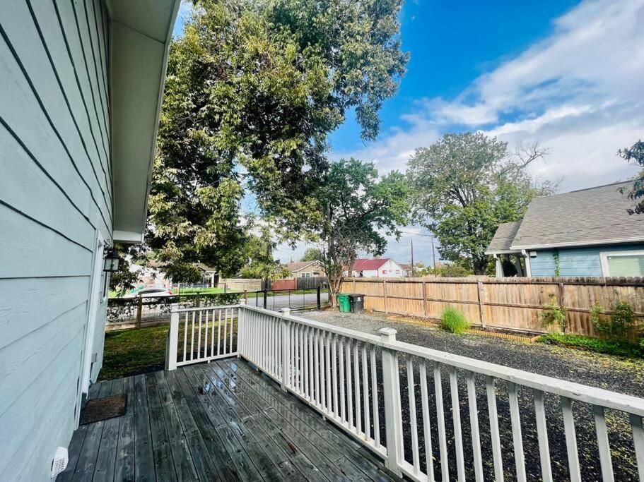 a porch of a house with a white fence at *Sweet Houston*/12ppl/3br/1b in Houston
