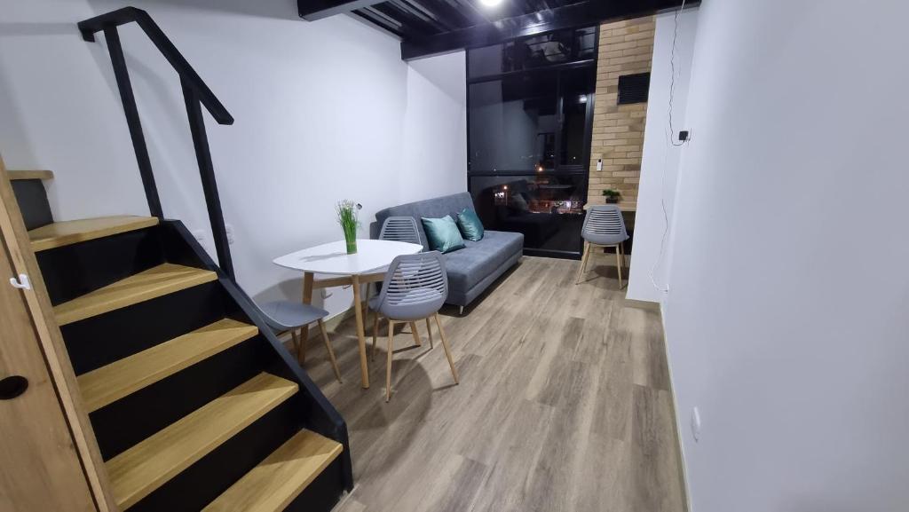 a living room with a couch and a table at Apartment in Bogota, Modelia, Airport in Bogotá