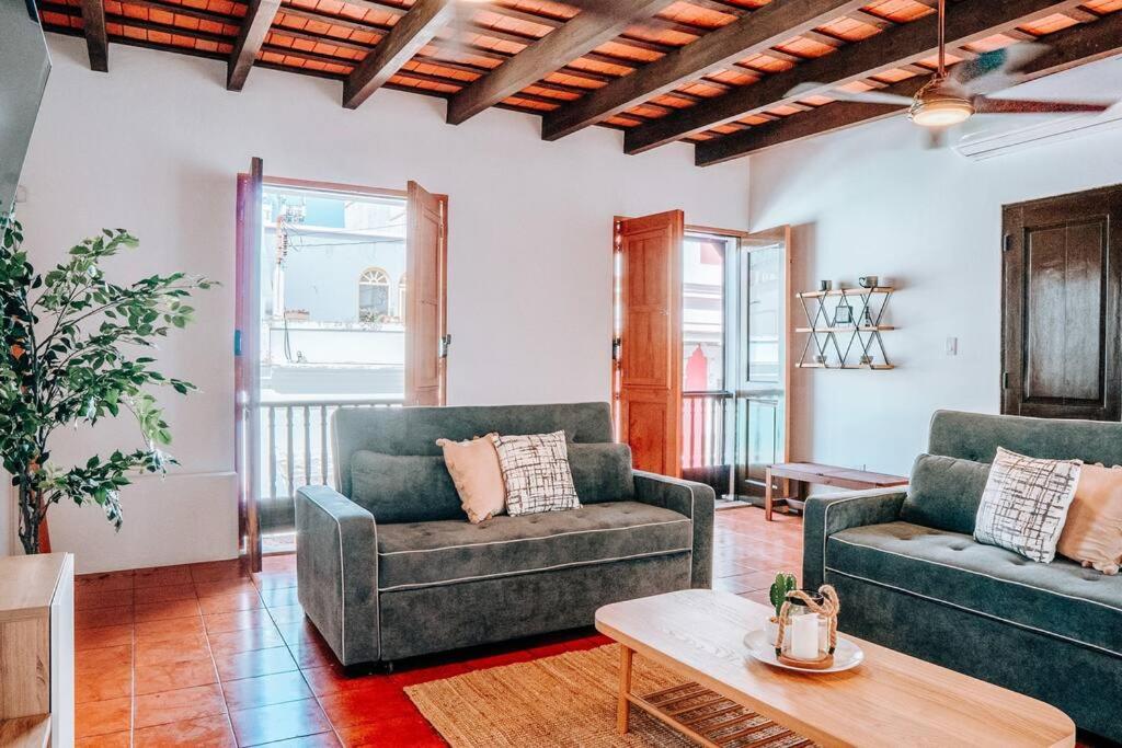a living room with two couches and a coffee table at Charming & Spacious Apt W/ Views @ Old San Juan in San Juan