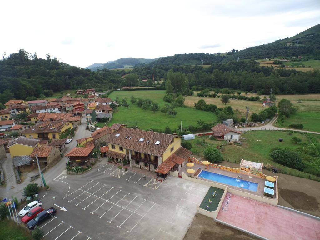 an aerial view of a small town with a parking lot at Hotel Intriago I & II in Intriago